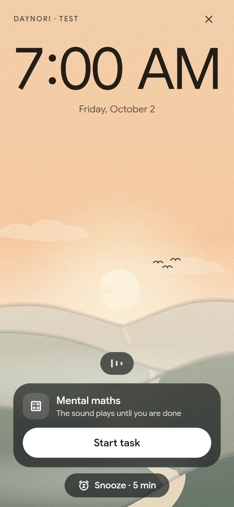 The alarm rings at 07:00 above the morning landscape.
