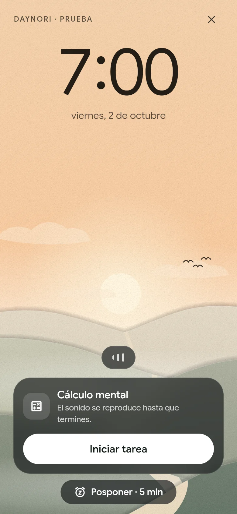 La alarma suena a las 07:00 sobre el paisaje de la mañana.