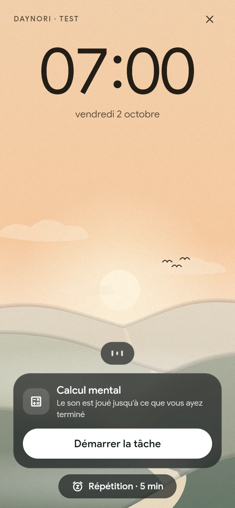 L’alarme sonne à 07:00 au-dessus du paysage matinal.